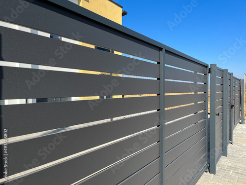 Slika na platnu Modern metal fence for fencing the yard area
