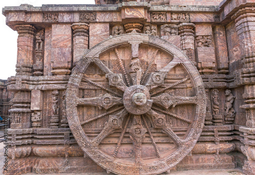 A stone wheel engraved in the walls of the 800 year old Sun Temple, Konark, India. The temple is designed as a chariot consisting of 24 such wheels.