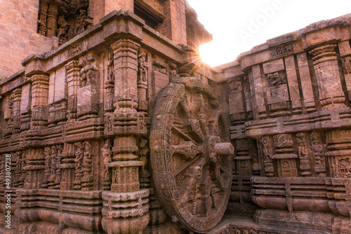 A stone wheel engraved in the walls of the 800 year old Sun Temple, Konark, India. The temple is designed as a chariot consisting of 24 such wheels. photo