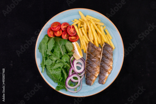 Delicious Grilled Fish On The Blue Plate