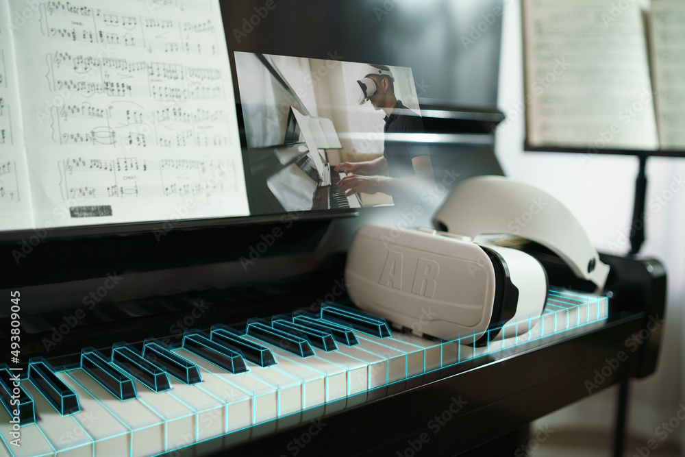 Concept of virtual reality online class piano lesson from home, VR