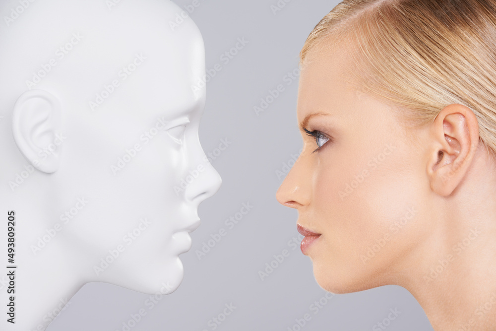 Fototapeta premium Face your problems. Close up of a woman looking at a dummy.