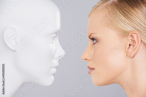 Face your problems. Close up of a woman looking at a dummy.
