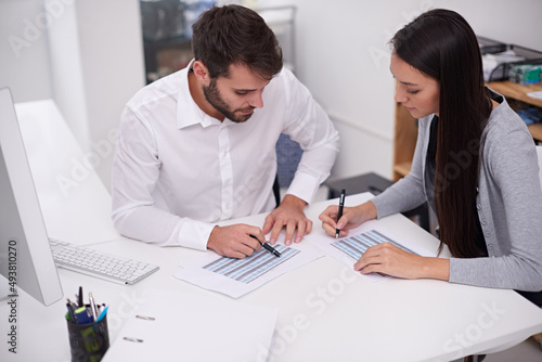 Wallpaper Mural Setting up their monthly schedule. Shot of two young business colleagues discussing documents in the office. Torontodigital.ca