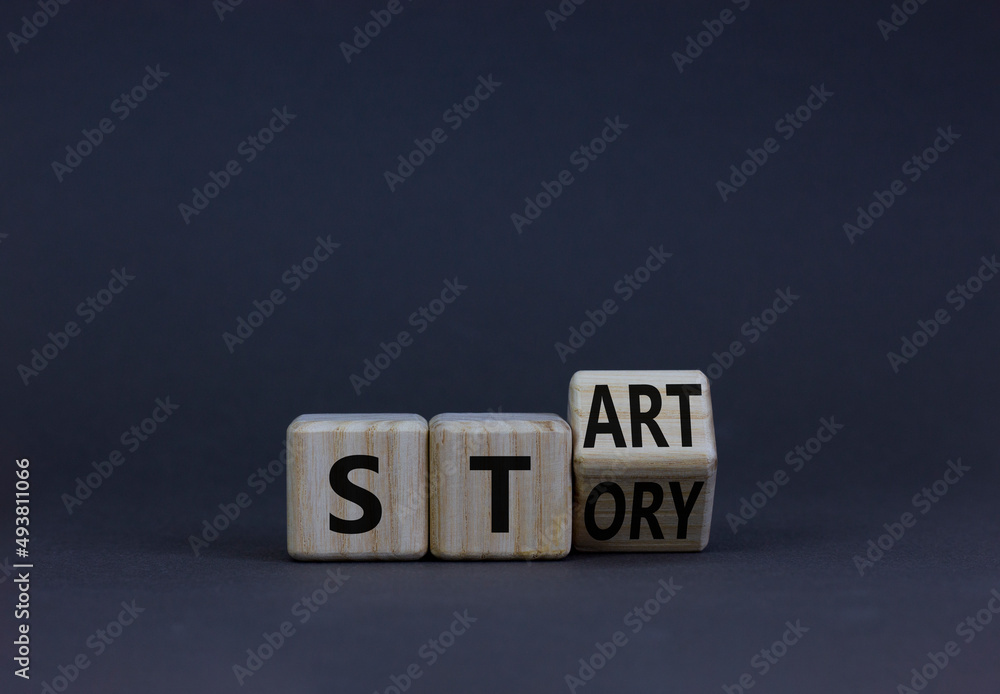 Start your story symbol. Turned the wooden cube and changed the concept word Start to Story. Beautiful grey table grey background, copy space. Business start your story concept. Start your story symbol. Turned the wooden cube and changed the concept word Start to Story. Beautiful grey table grey background, copy space. Business start your story concept.