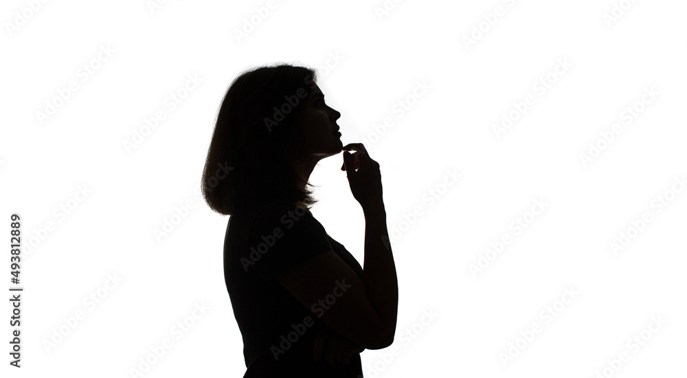 Silhouette of young black woman thinking something.