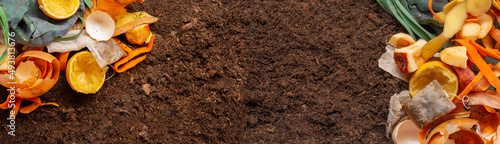 organic compost - biodegradable kitchen waste and soil photo