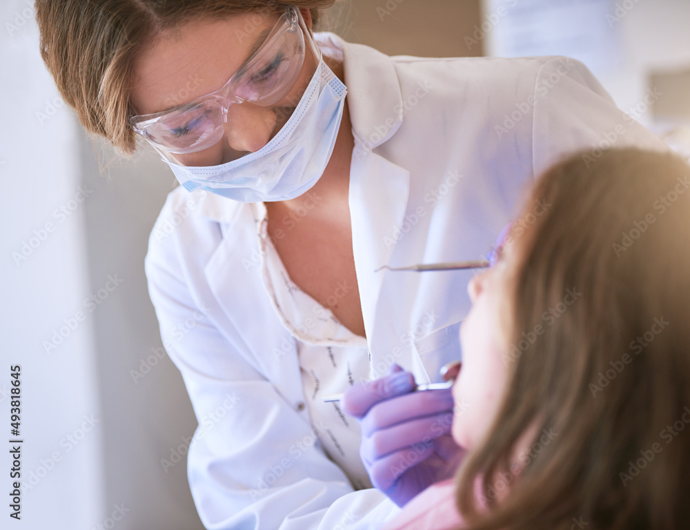 My goal is to provide exceptional care for your child. Cropped shot of a dentist examining a little girls teeth. My goal is to provide exceptional care for your child. Cropped shot of a dentist examining a little girls teeth.