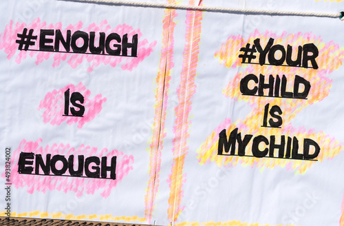 placard or poster with hand written words or text and hashtags concept gender based violence and violence against women and children