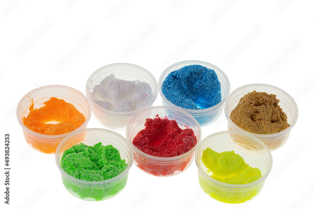 Close up view of colorful play dough materials isolated on white background. Close up view of colorful play dough materials isolated on white background.