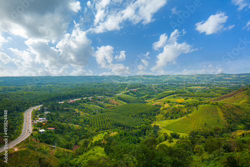 aerial view of roads and mountains,view of curve road through green forest and mountain rural scene north of Thailand