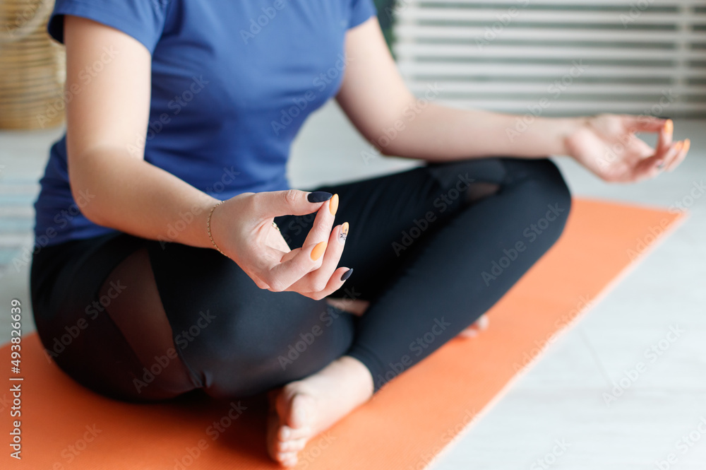 Cropped photo of a meditating woman. Digital detox, mental health and yoga practice in everyday life concept.