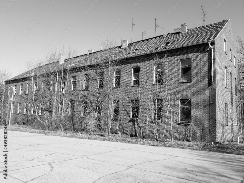 A neglected apartment building in black and white