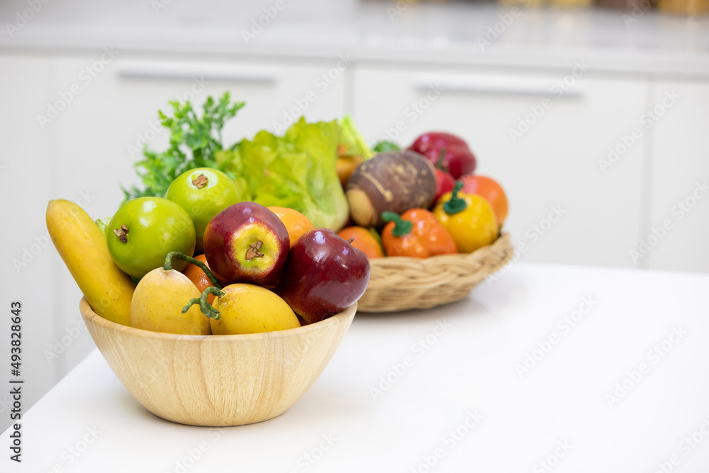 delicious ripe fruits in wooden bowl on a table delicious ripe fruits in wooden bowl on a table