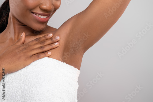 Hair Removal Concept. Unrecognizable Black Female Demonstrating Her Armpit With Smooth Skin photo