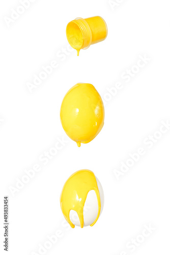 Yellow paint pours on the eggs