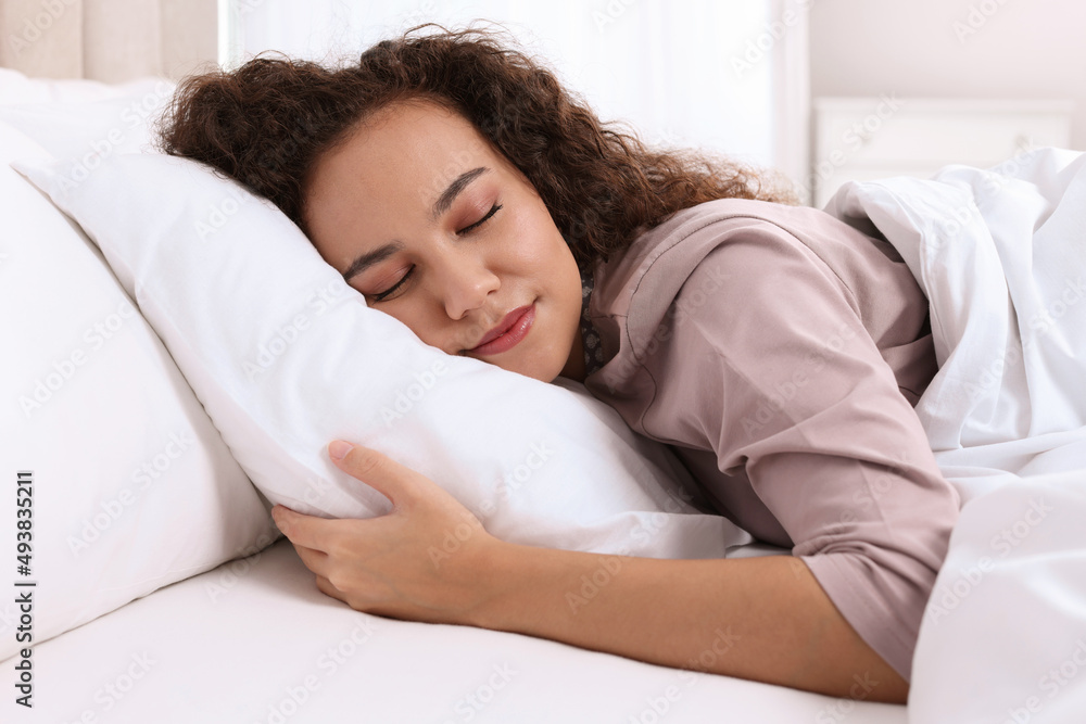 Beautiful African American woman sleeping in bed at home Beautiful African American woman sleeping in bed at home