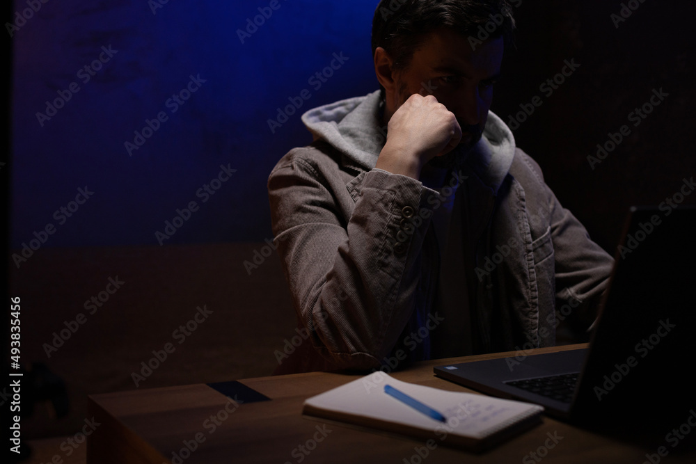Man thinking near laptop computer workplace. Businessman working hom Man thinking near laptop computer workplace. Businessman working hom