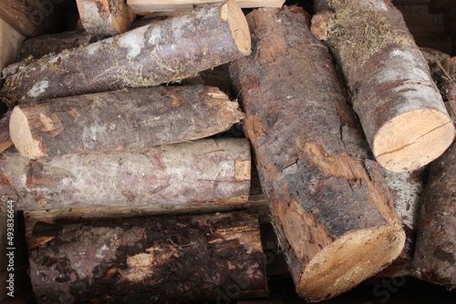 A pile of firewood for the fireplace is laid out in a wooden box.