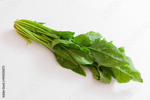 Spinach leaves isolated on white background, top view