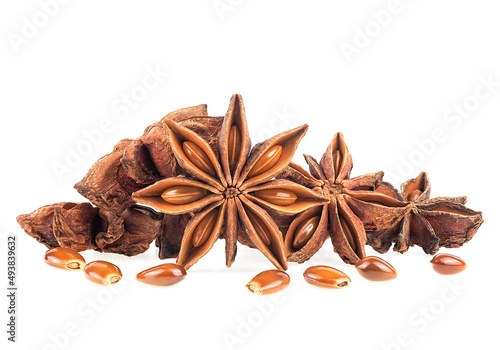 Dry anise stars with seeds isolated on a white background, front view. Star anise spice fruits.