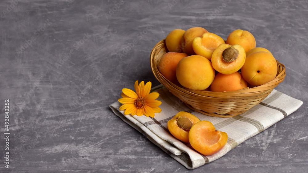 ripe apricots in a wicker basket copy space