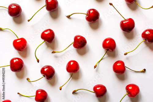 red cherries on a light background of flatley