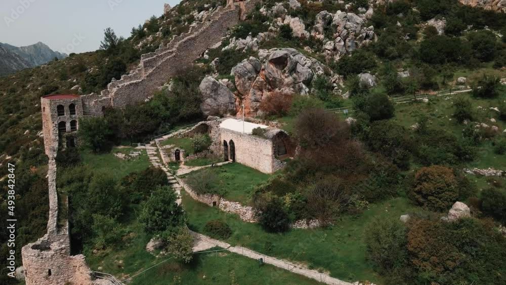 Aerial 4k Saint Hilarion Castle medieval building situated on top of mountain is surrounded with nature which has an amazing picturesque landscape of Mediterranean Sea in Kyrenia, North Cyprus Aerial 4k Saint Hilarion Castle medieval building situated on top of mountain is surrounded with nature which has an amazing picturesque landscape of Mediterranean Sea in Kyrenia, North Cyprus