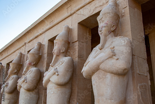 Hatshepsut statues by the columns on the highest terrace of the Mortuary Temple of Hatshepsut, Luxor, Egypt