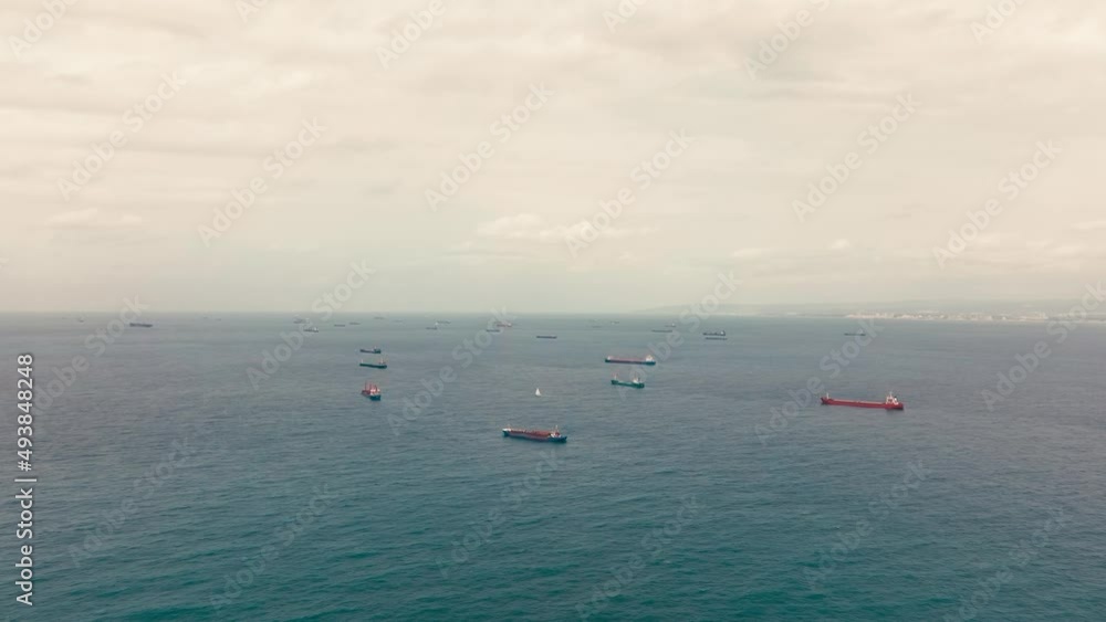 Fifty Cargo and Container ships anchored close to port due to worldwide Maritime congestion crisis, Aerial view. Fifty Cargo and Container ships anchored close to port due to worldwide Maritime congestion crisis, Aerial view.