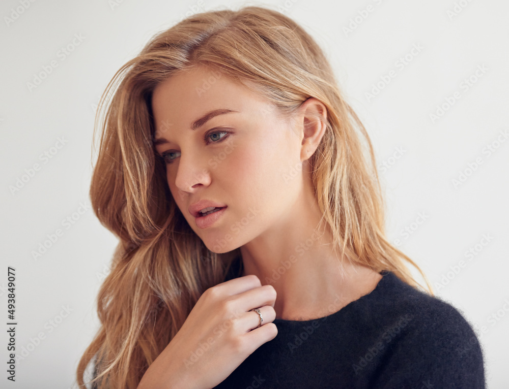 People change, memories dont. Shot of a beautiful young woman looking thoughtful. People change, memories dont. Shot of a beautiful young woman looking thoughtful.