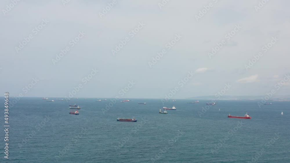 Fifty Cargo and Container ships anchored close to port due to worldwide Maritime congestion crisis, Aerial view. Fifty Cargo and Container ships anchored close to port due to worldwide Maritime congestion crisis, Aerial view.