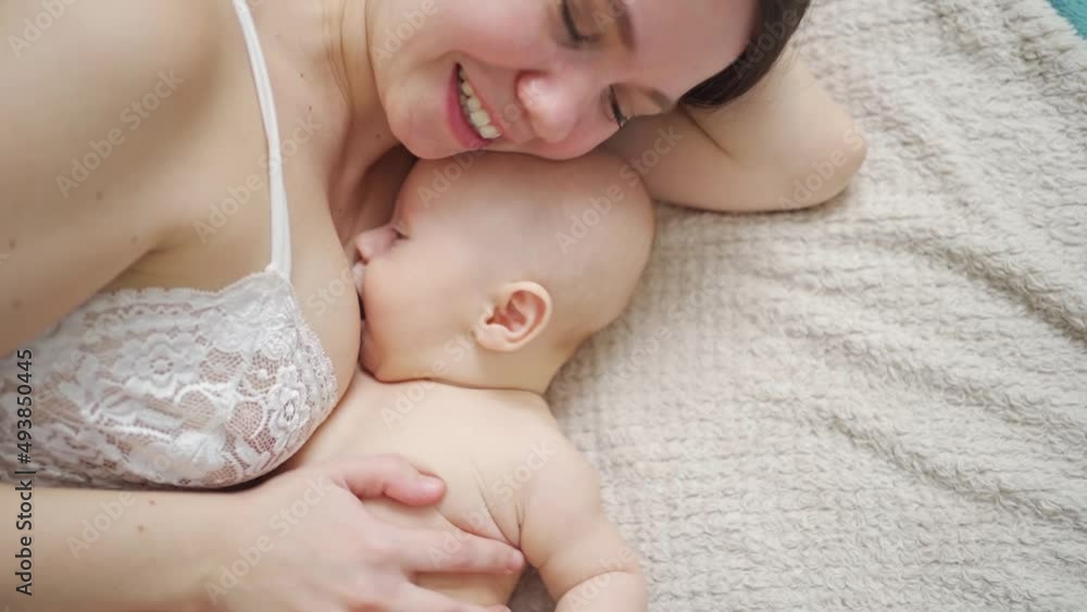 a mother and the baby on the bed. maternal and child health. a mother and the baby on the bed. maternal and child health.