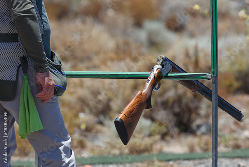 Skeet shooting shotgun ready to fire