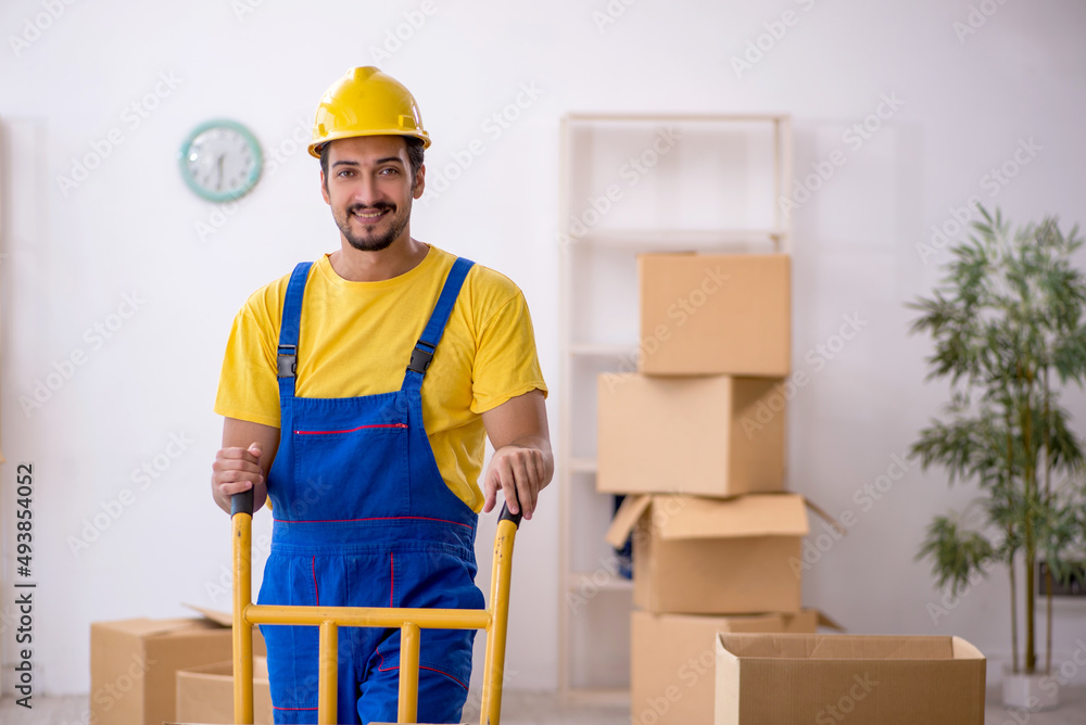 Young male contractor doing home relocation Young male contractor doing home relocation