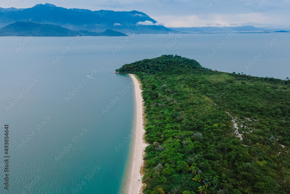 Beach, mountains and cloudy sky in Florianopolis. Aerial view