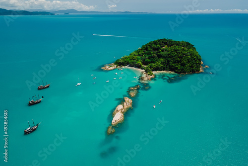 Island Ilha do Frances with boats and blue ocean in Florianopolis, Brazil. Aerial view