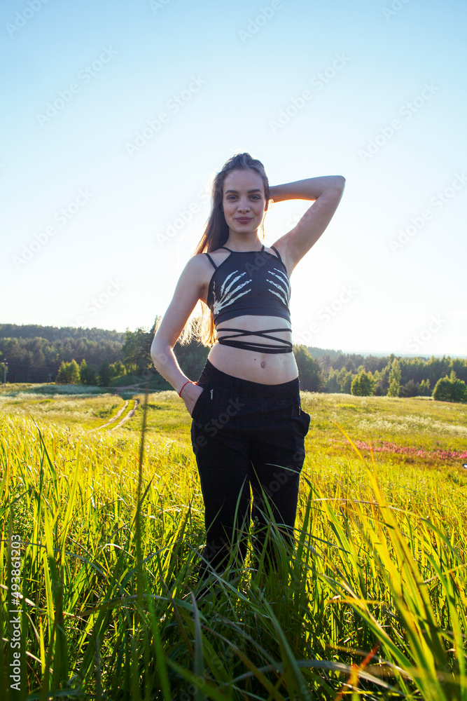 young pretty blond caucasian girl resting in green field at summer, lifestyle people concept young pretty blond caucasian girl resting in green field at summer, lifestyle people concept