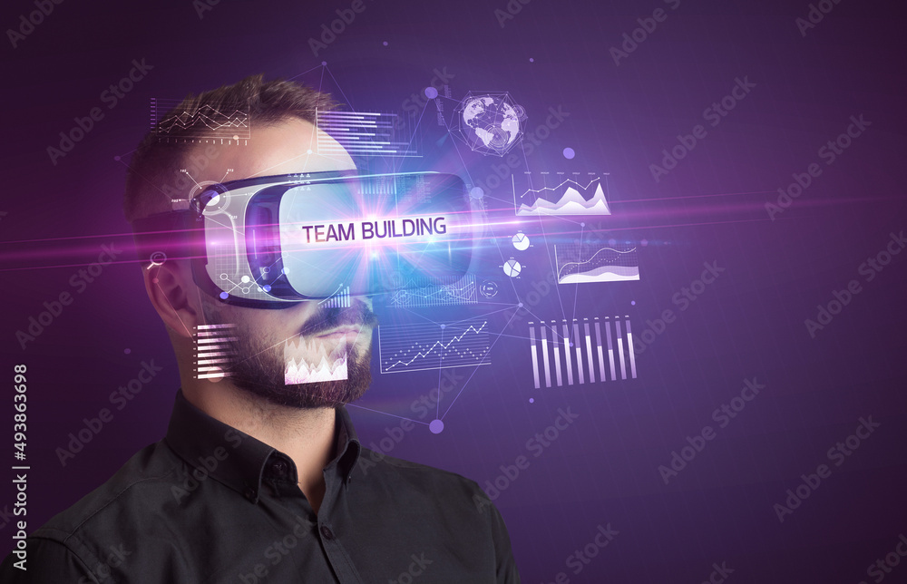 Businessman looking through Virtual Reality glasses Businessman looking through Virtual Reality glasses