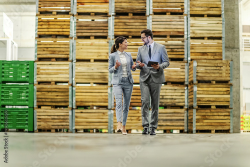 Business talk and walk in the warehouse.
