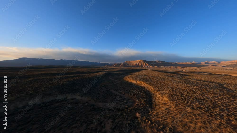 Desert landscape foliage fast flying over bushes winding dry riverbed Desert landscape foliage fast flying over bushes winding dry riverbed