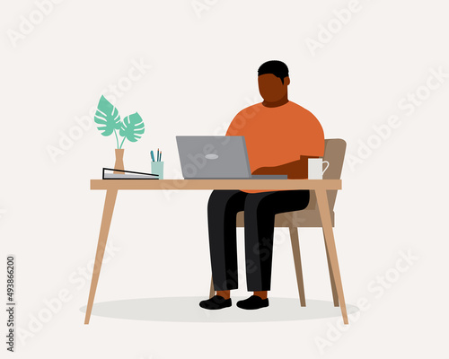 Fat Black Man With Laptop Working At Home.