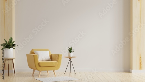 Fototapeta Naklejka Na Ścianę i Meble -  Modern minimalist interior with an yellow armchair on empty white wall background.