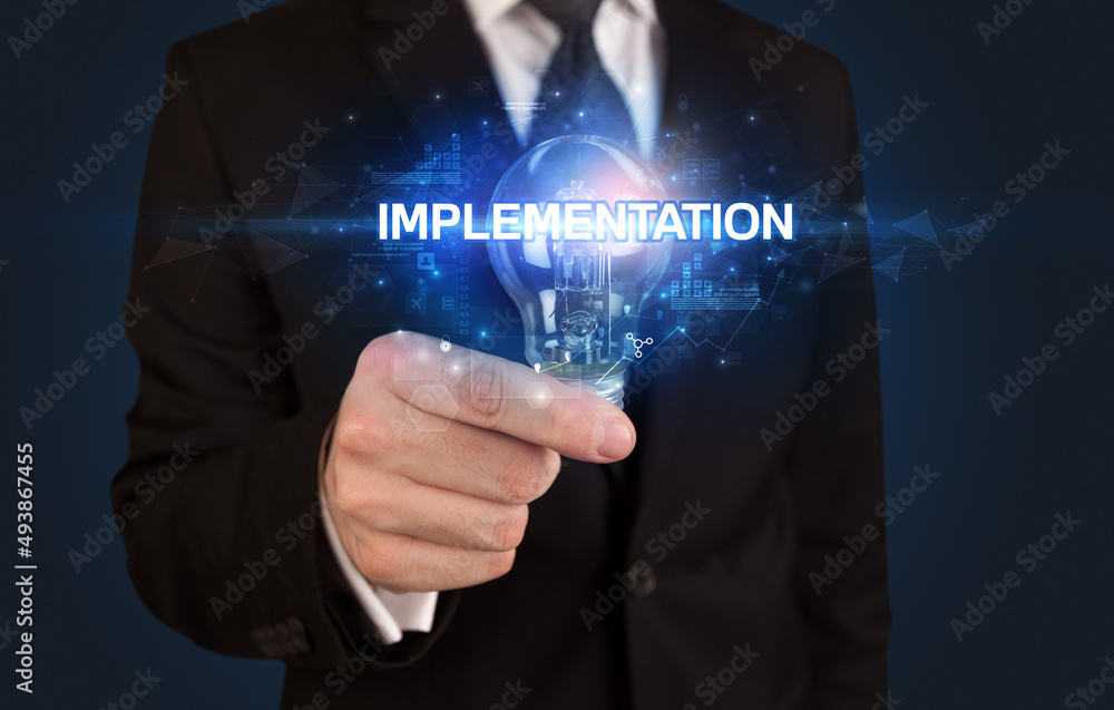 Businessman holding a light bulb Businessman holding a light bulb