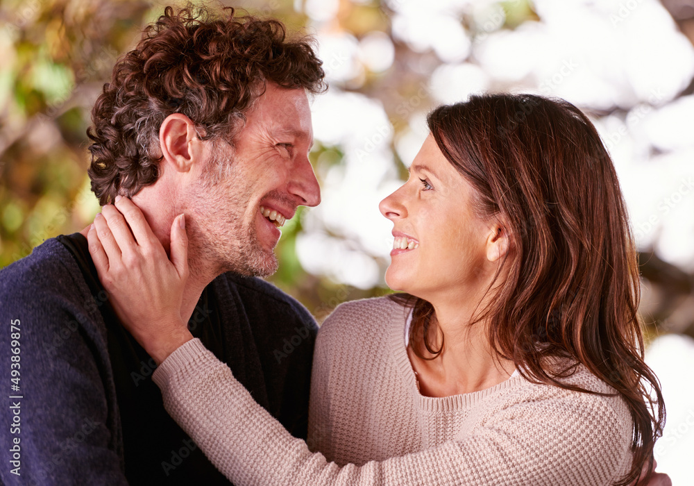 Comfortable in each others company. An affectionate mature couple outdoors. Comfortable in each others company. An affectionate mature couple outdoors.