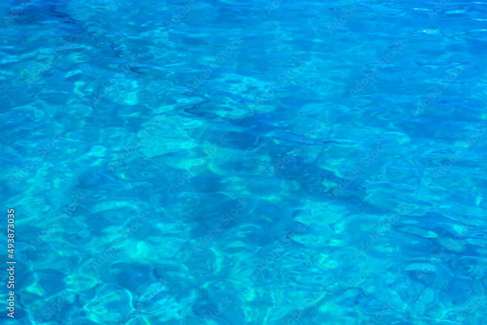 Background with blue water surface, with reflections