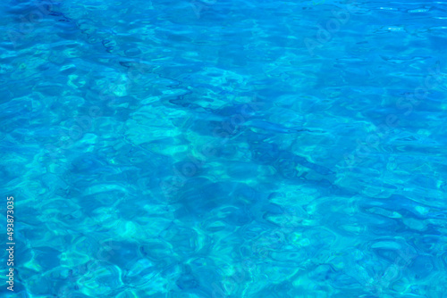 Background with blue water surface, with reflections