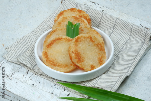 Wingko (wingko babat ) or javanese pancake.is a Indonesian traditional food, a sweet snack made from young coconut, glutinous rice flour and sugar photo