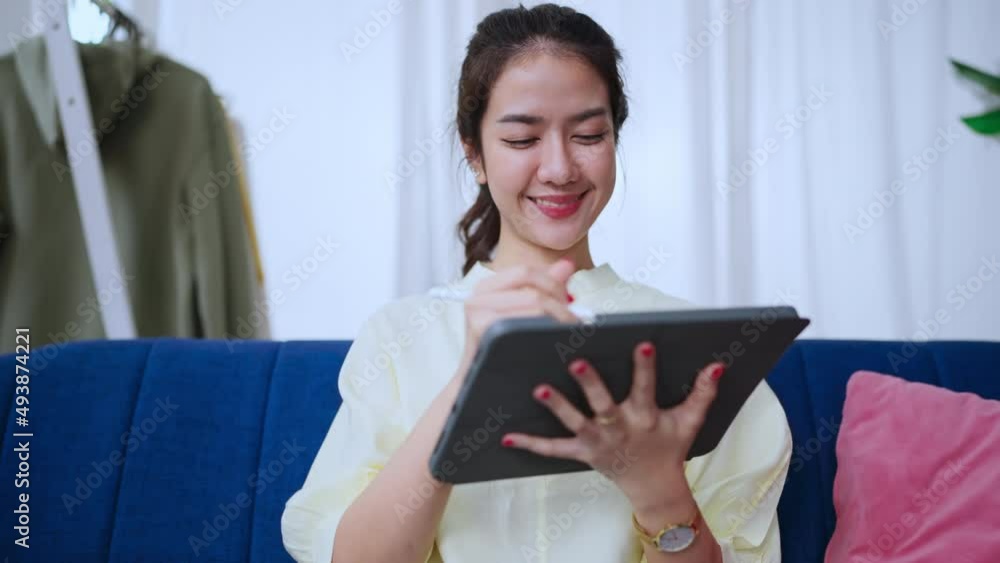 asian attractive female woman wear casual cloth home isolate quarantine enjoy watching online movie on tablet on sofa in living room home interior background home sweet home clam peaceful weekend day asian attractive female woman wear casual cloth home isolate quarantine enjoy watching online movie on tablet on sofa in living room home interior background home sweet home clam peaceful weekend day