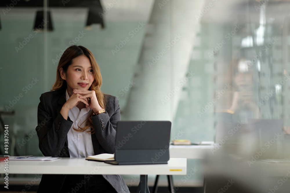Portrait of charming young businesswoman working for financial on laptop in boardroom. Portrait of charming young businesswoman working for financial on laptop in boardroom.